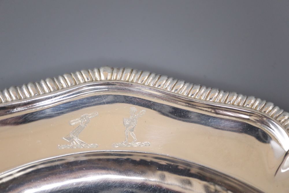 A pair of George IV silver shaped circular dinner plates, with gadrooned borders,